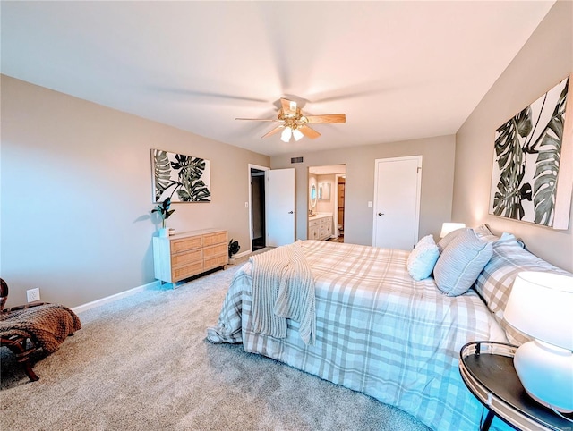 bedroom featuring connected bathroom, ceiling fan, and carpet flooring