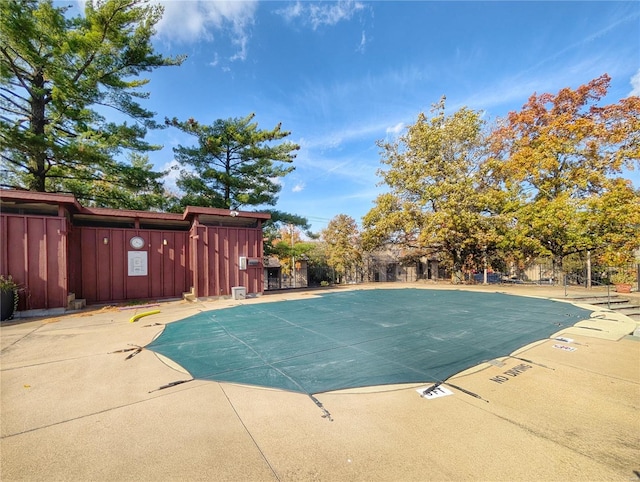 view of swimming pool featuring a patio area