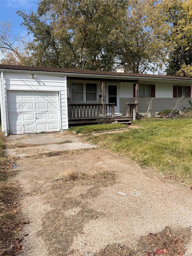 ranch-style house featuring a garage and a porch