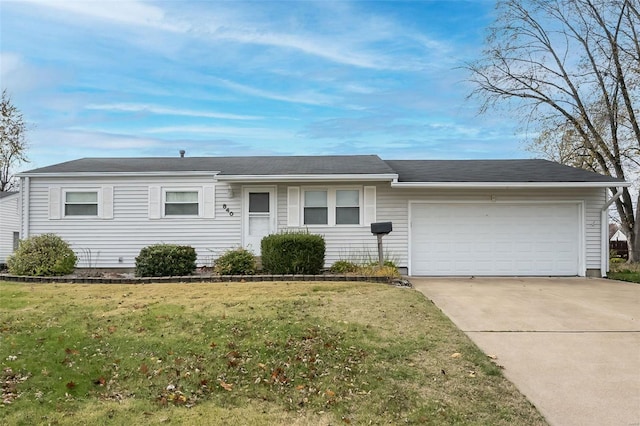 single story home featuring a front yard and a garage