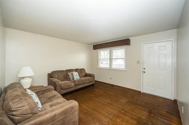 living room with dark hardwood / wood-style flooring