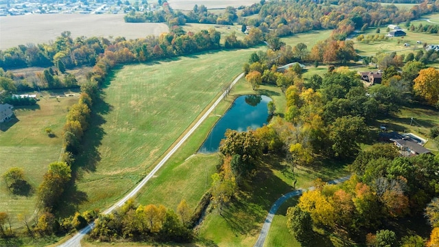 birds eye view of property featuring a rural view and a water view