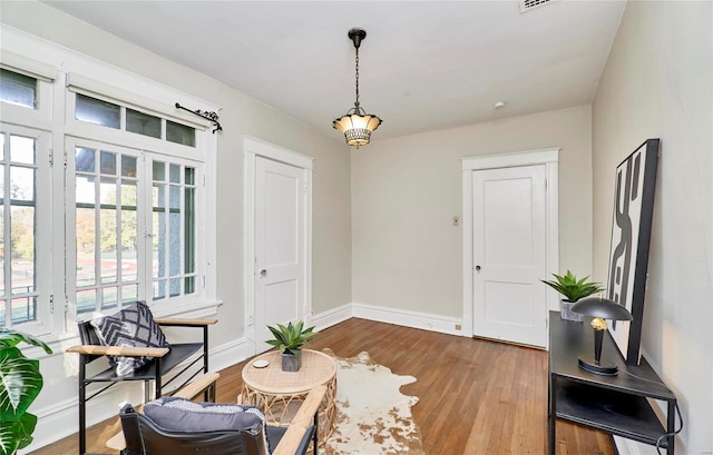 sitting room featuring hardwood / wood-style floors