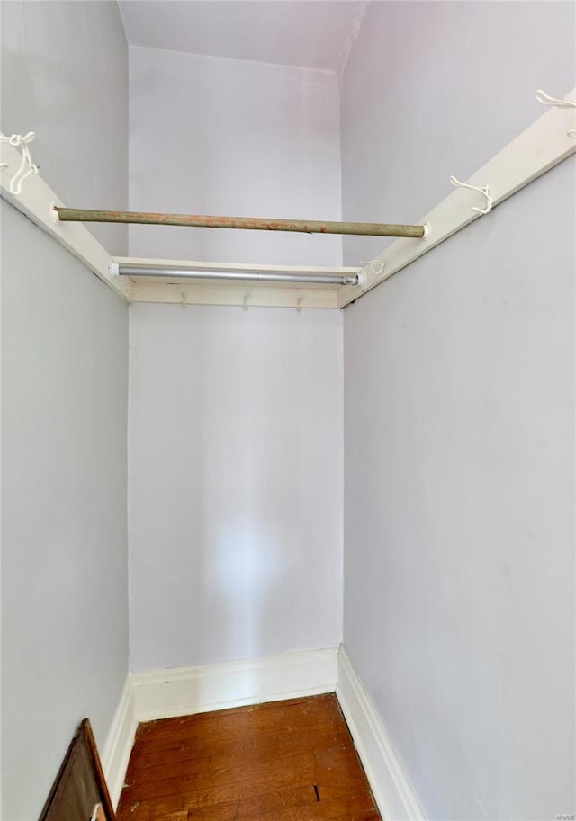 spacious closet featuring hardwood / wood-style floors