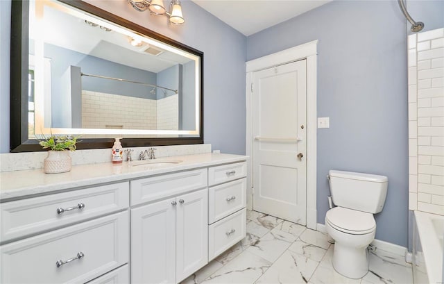 full bathroom featuring tiled shower / bath, vanity, and toilet