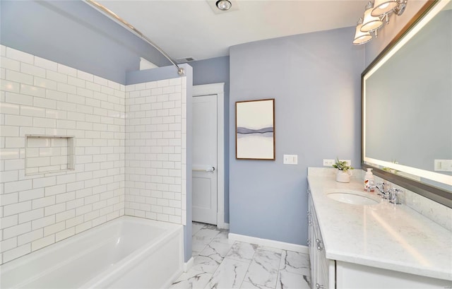 bathroom with vanity and tiled shower / bath combo