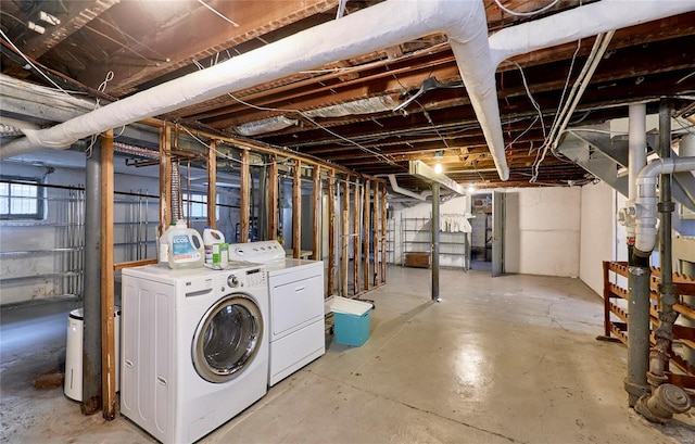 basement with washing machine and clothes dryer