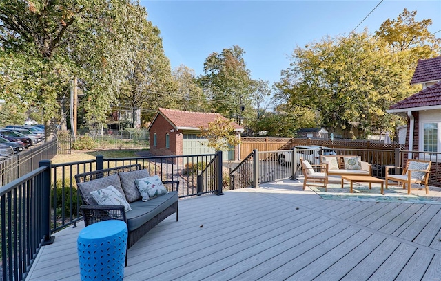 wooden deck with an outdoor structure, an outdoor living space, and a garage