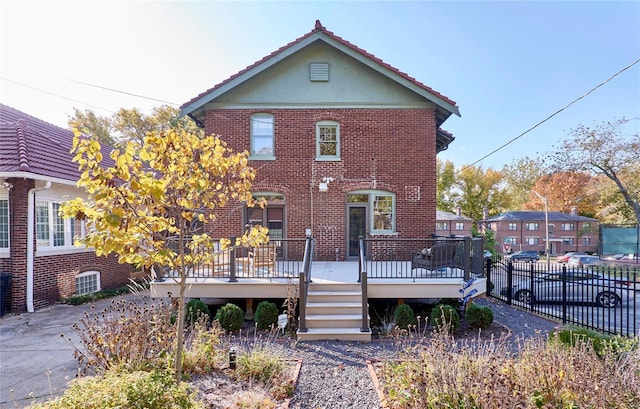 view of front of home with a wooden deck