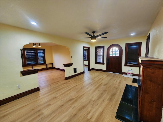 entrance foyer featuring light hardwood / wood-style flooring and ceiling fan