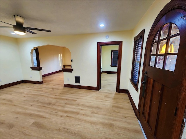 unfurnished room with ceiling fan and light wood-type flooring