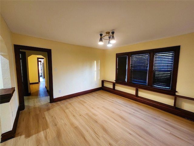 spare room featuring light wood-type flooring