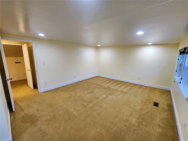 spare room with light colored carpet