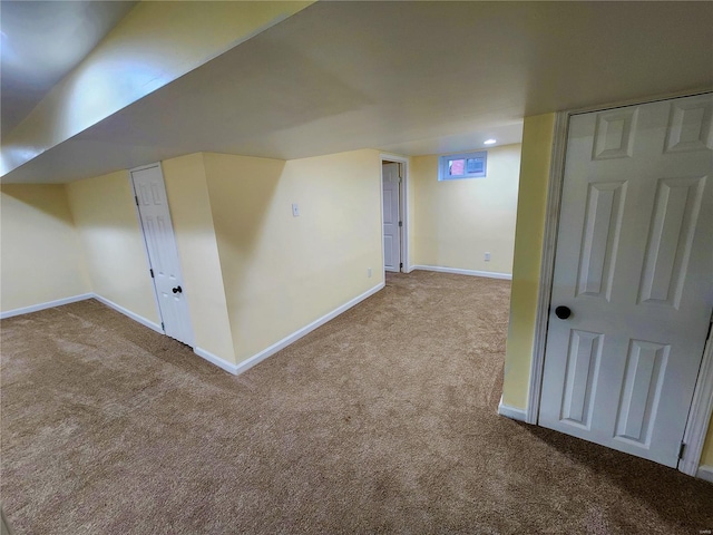 bonus room featuring light colored carpet