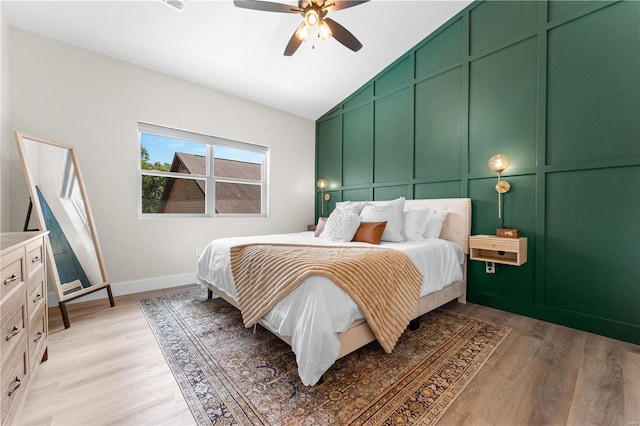 bedroom featuring vaulted ceiling, light wood-type flooring, and ceiling fan