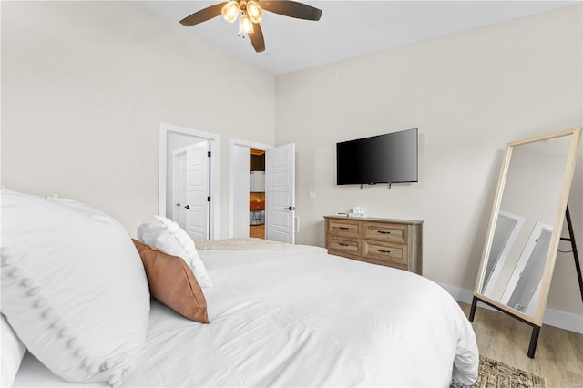 bedroom featuring light hardwood / wood-style floors and ceiling fan