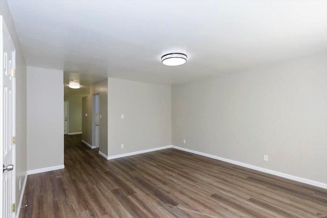 empty room featuring dark hardwood / wood-style flooring