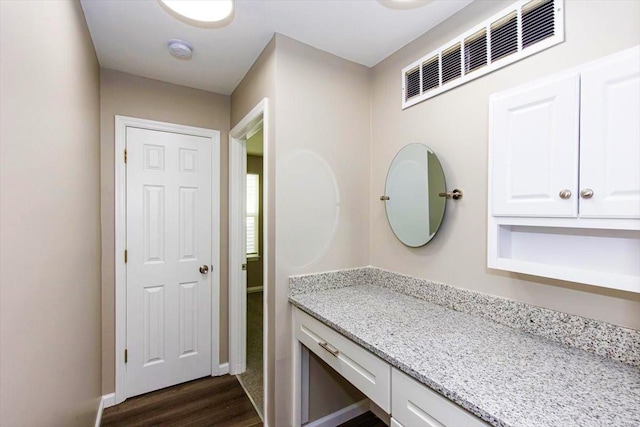 bathroom featuring vanity and hardwood / wood-style flooring