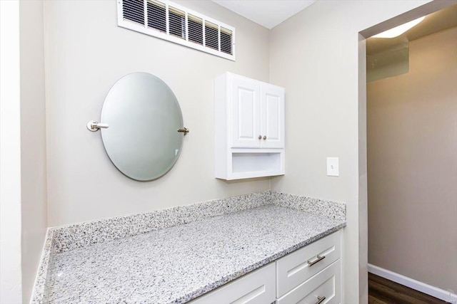 bathroom featuring vanity and hardwood / wood-style floors