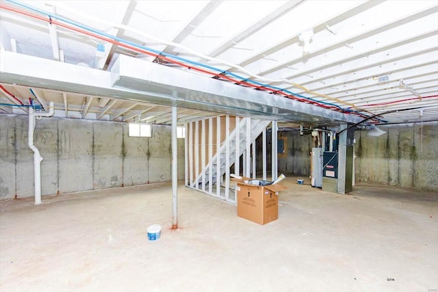 basement with heating unit and water heater