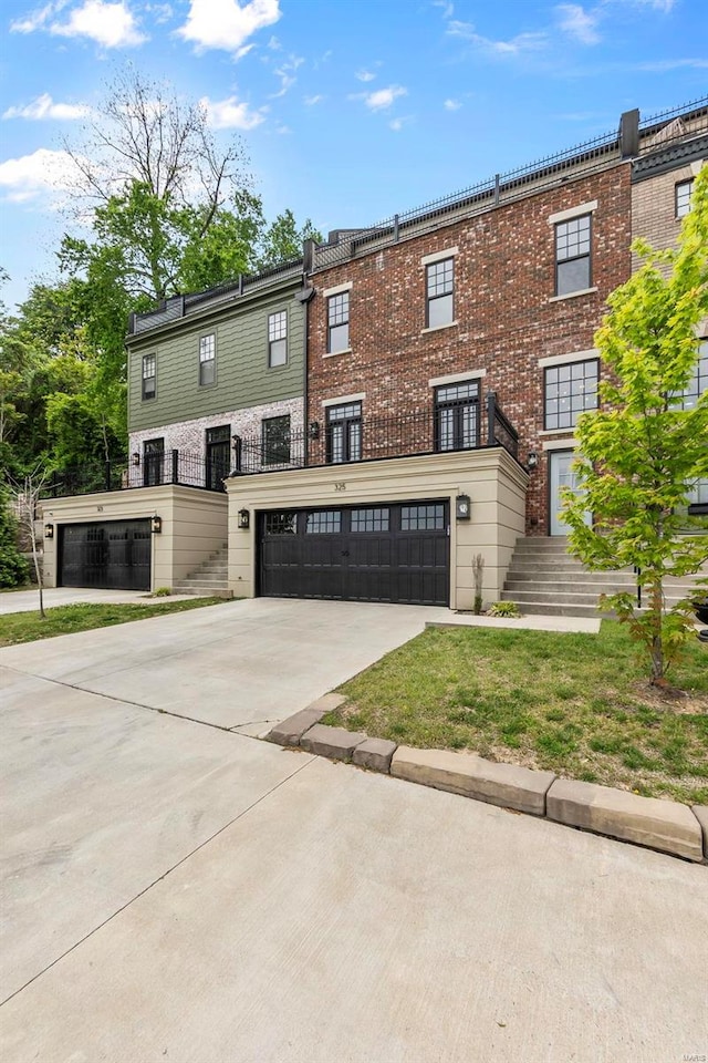 townhome / multi-family property featuring a garage