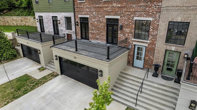 view of front of property with a balcony and a garage