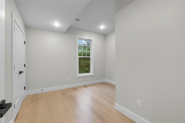 unfurnished room with light wood-type flooring