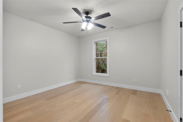 unfurnished room with light hardwood / wood-style flooring and ceiling fan