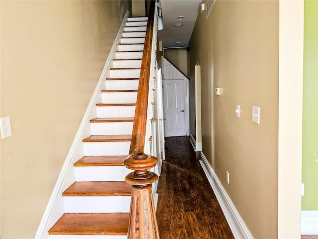 stairway with hardwood / wood-style floors