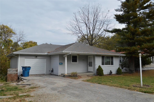 view of front of house with a front lawn and a garage