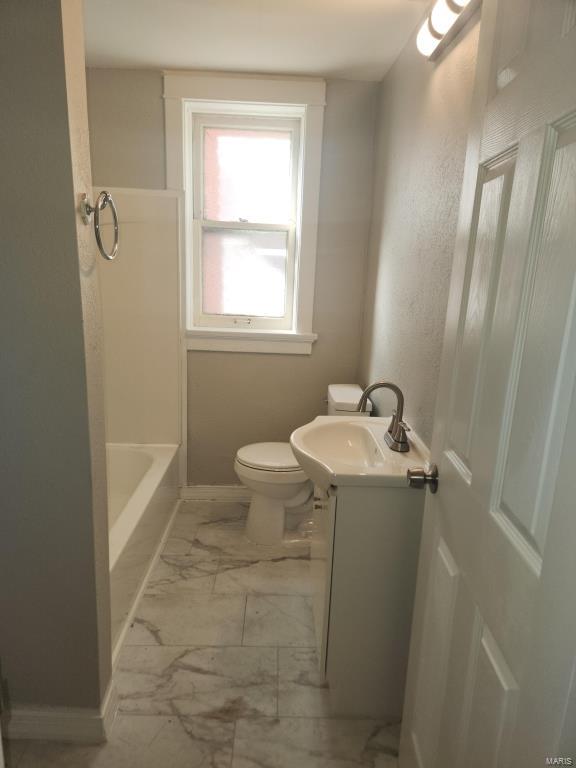 full bathroom with vanity, shower / bathing tub combination, and toilet