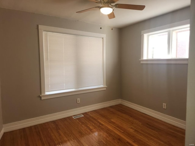 empty room featuring wood-type flooring and ceiling fan