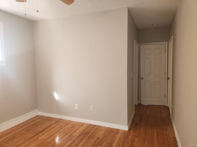 empty room with light hardwood / wood-style floors and ceiling fan