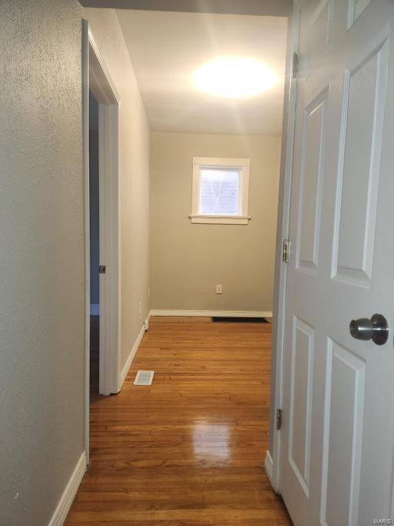 hallway featuring light hardwood / wood-style flooring