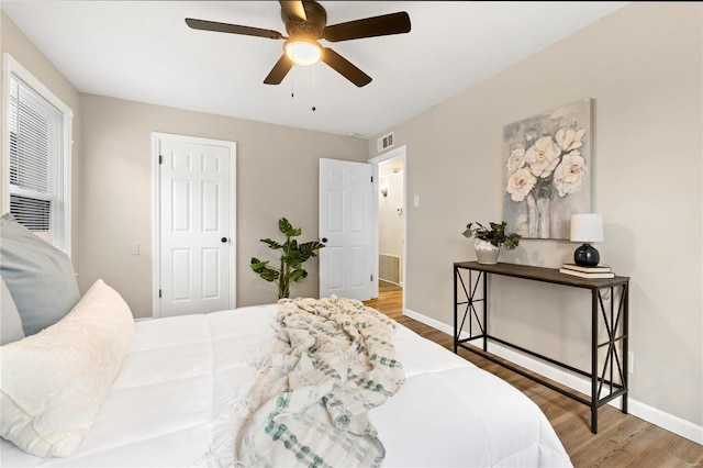 bedroom with hardwood / wood-style flooring and ceiling fan