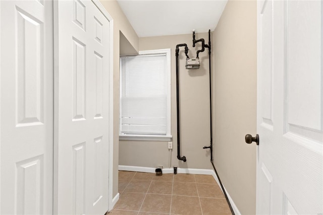 hallway featuring light tile patterned floors