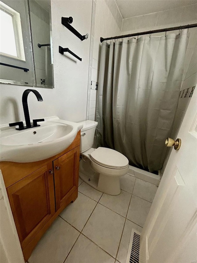 full bathroom with toilet, tile patterned floors, vanity, visible vents, and a shower with curtain