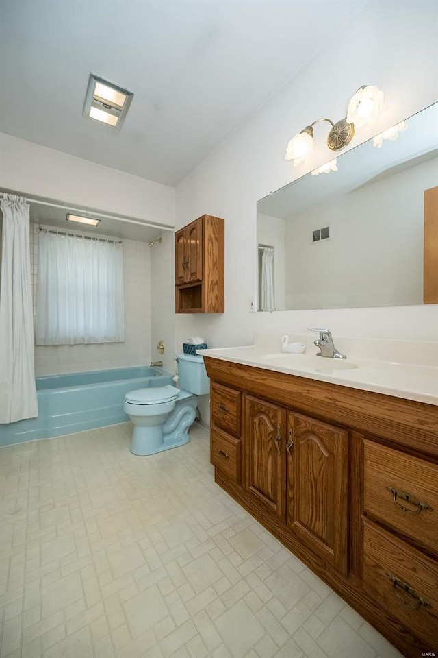 full bath featuring vanity, shower / tub combo, toilet, and visible vents