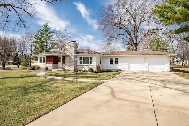 view of front of property featuring driveway, a front lawn, stone siding, an attached garage, and a chimney