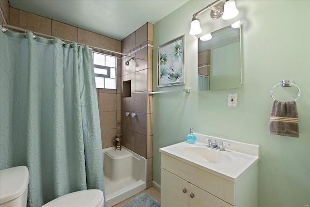 bathroom featuring vanity, toilet, and a shower with shower curtain