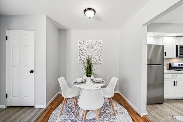 dining room with light hardwood / wood-style flooring