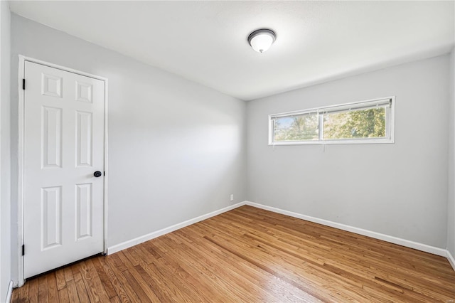 unfurnished room featuring wood-type flooring