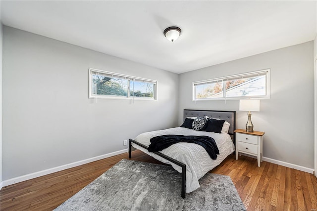 bedroom with hardwood / wood-style floors