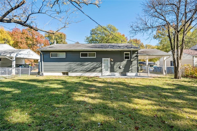 rear view of property with a yard and a patio