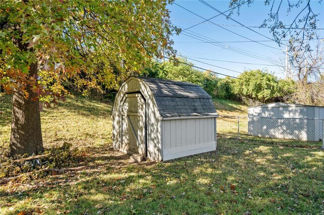 view of outdoor structure featuring a lawn