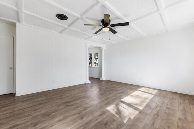 empty room featuring hardwood / wood-style floors, coffered ceiling, ornate columns, and ceiling fan