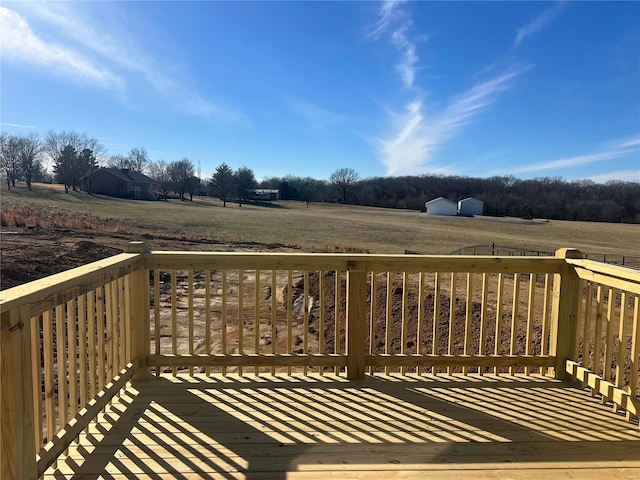 wooden terrace with a rural view