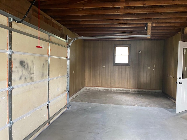 garage featuring wooden walls