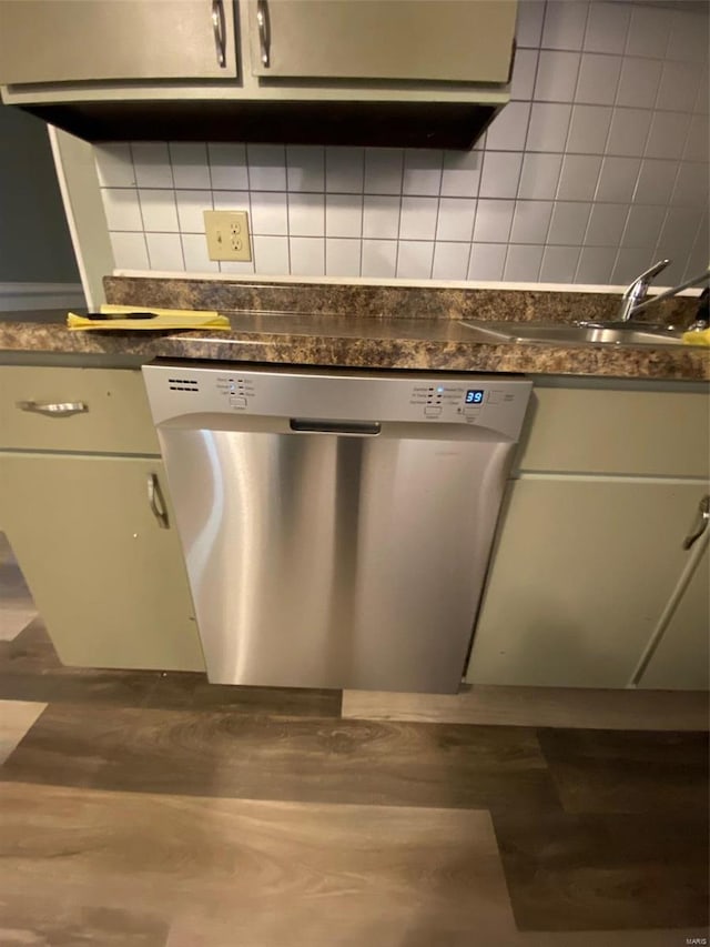 kitchen featuring decorative backsplash, stainless steel dishwasher, and sink