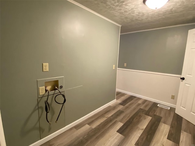 laundry room with crown molding, washer hookup, a textured ceiling, and dark hardwood / wood-style floors